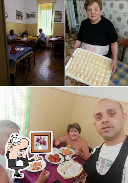 La foto di interni e tavolo da pranzo da Osteria Real