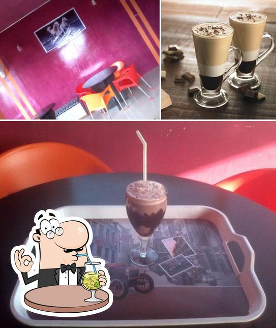 Take a look at the image depicting drink and interior at Hangouts Cafe