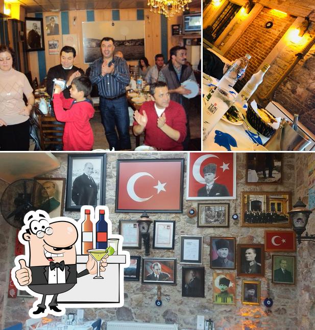 Take a look at the image displaying bar counter and interior at Tik Mustafa's Place