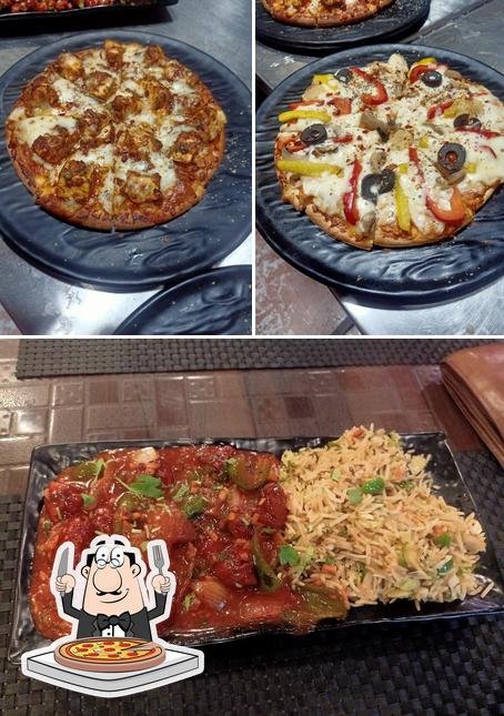 Try out pizza at Kavya's Restro