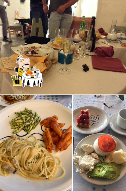 Questa è la foto che mostra la cibo e tavolo da pranzo di Cala di Volpe Barbecue Restaurant