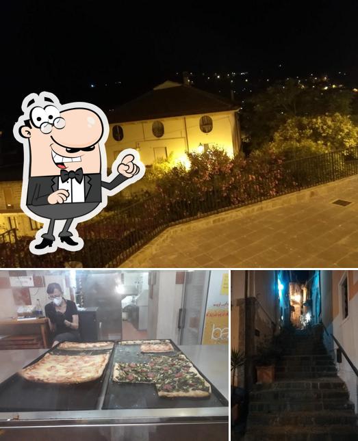 La immagine di esterno e pizza da Pizzeria Occhio Di Lince