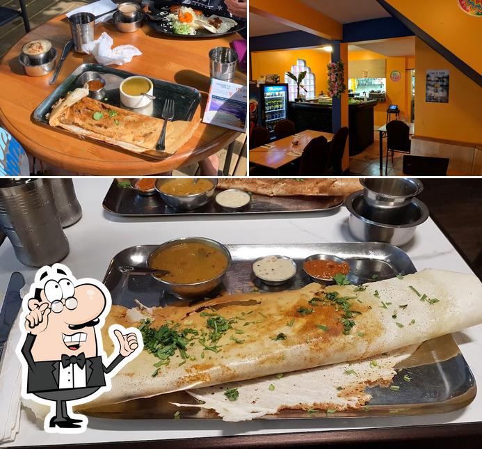 Take a look at the picture showing interior and food at Kootenay Tamil Kitchen