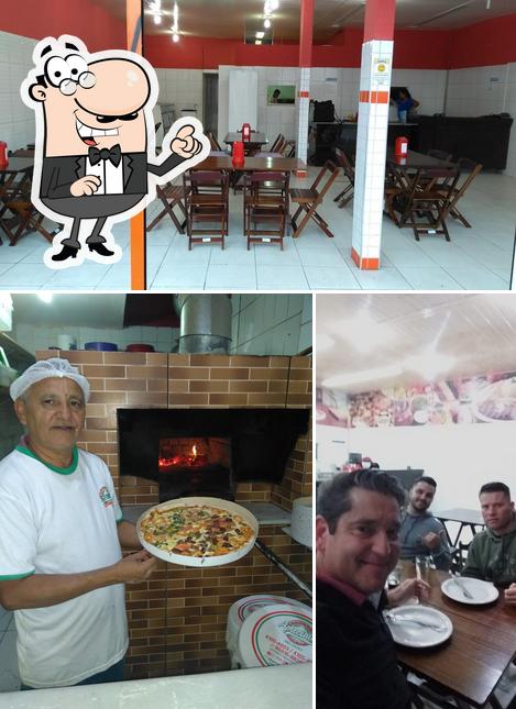 O interior do Pizzaria Apreciatta