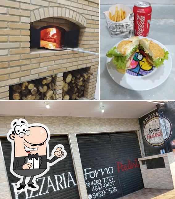 Dê uma olhada a imagem ilustrando interior e bebida a Pizzaria Forno Paulista