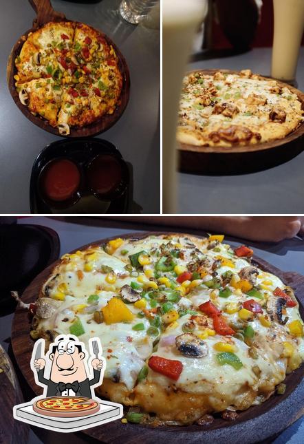 Order pizza at Hunter’s Den Veg & Non-Veg Restaurant