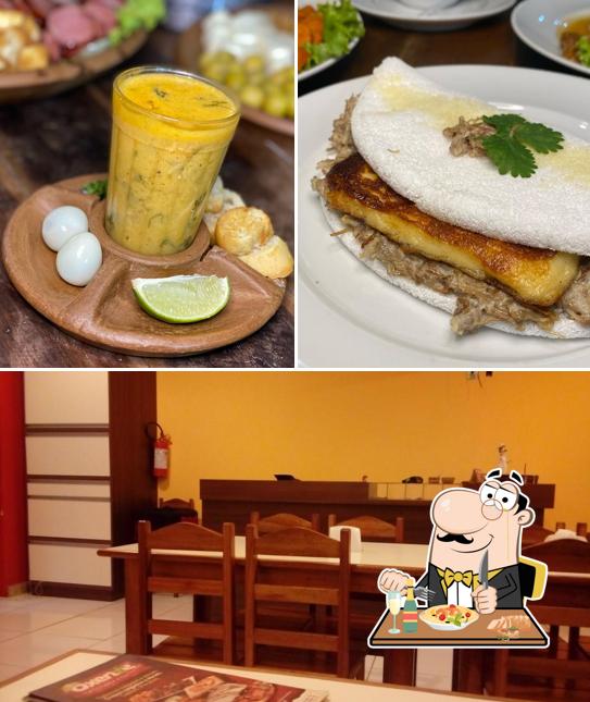 A imagem a Oxente Tapiocaria’s comida e interior