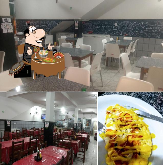 Entre diversos coisas, comida e interior podem ser encontrados no Pizzaria Magju desde1983