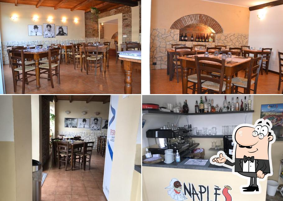 La foto della interni e tavolo da pranzo di Pizzeria Naplé