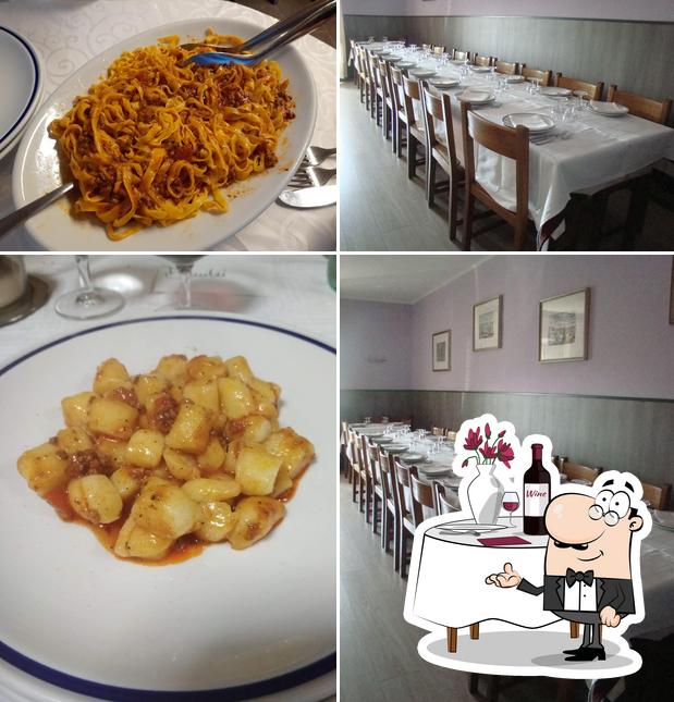 La immagine della tavolo da pranzo e cibo di Osteria della Vedova