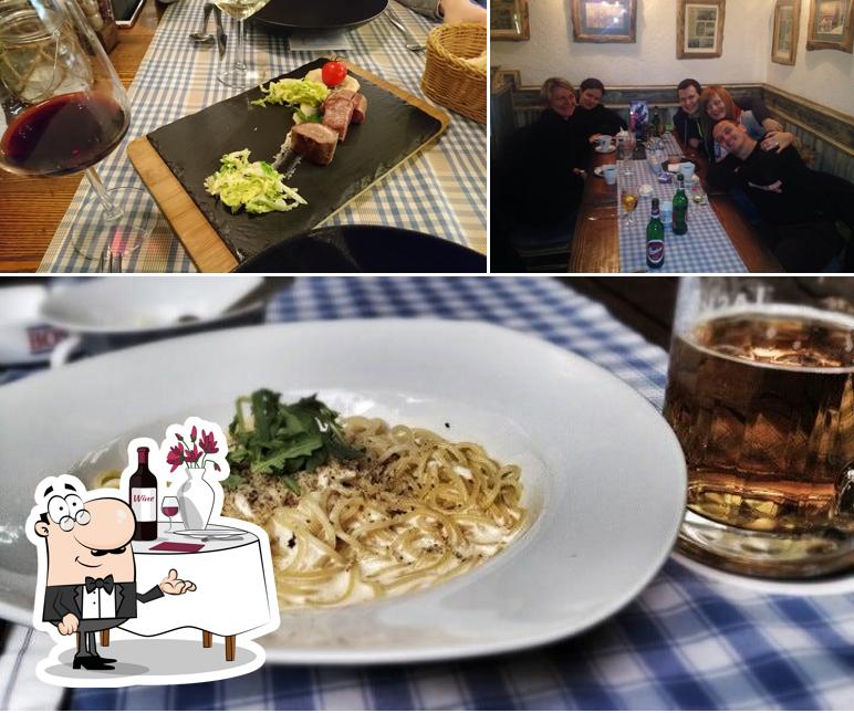 Questa è la immagine che presenta la tavolo da pranzo e cibo di Spaghetti and pizzeria Koper