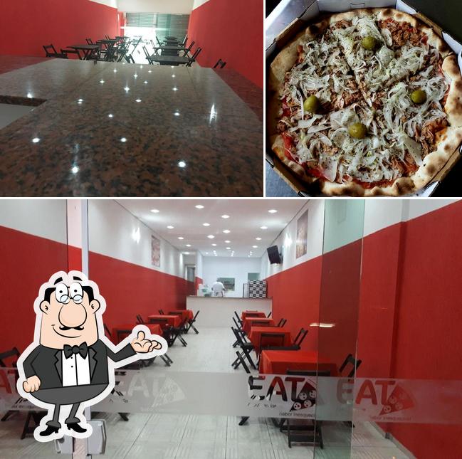 A interior e pizza do restaurante