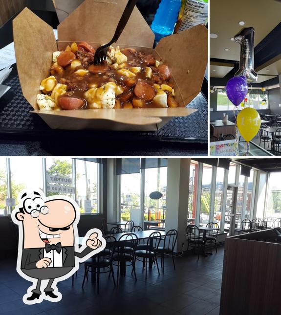 Vérifiez la photo indiquant la intérieur et nourriture concernant La Poutine D’or Ste-Marie