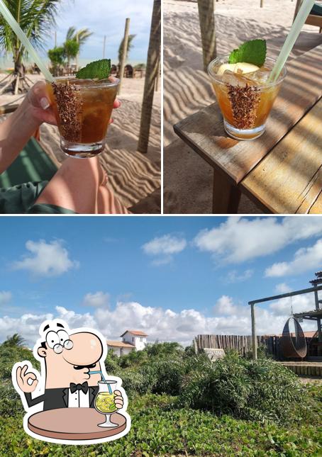 Entre diferentes coisas, bebida e exterior podem ser encontrados a Coral Praia Bar - Xandó Caraíva