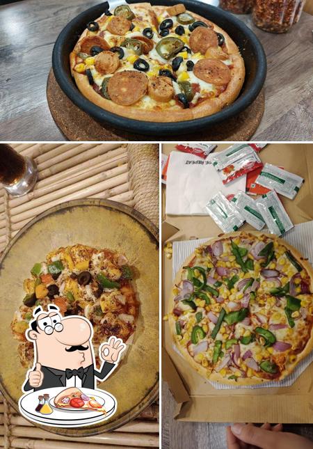 Try out pizza at Pizza Hut Crown Interior Mall, Faridabad