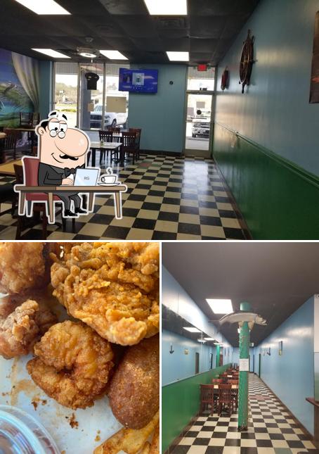 This is the image showing interior and food at Ocean Bay Seafood