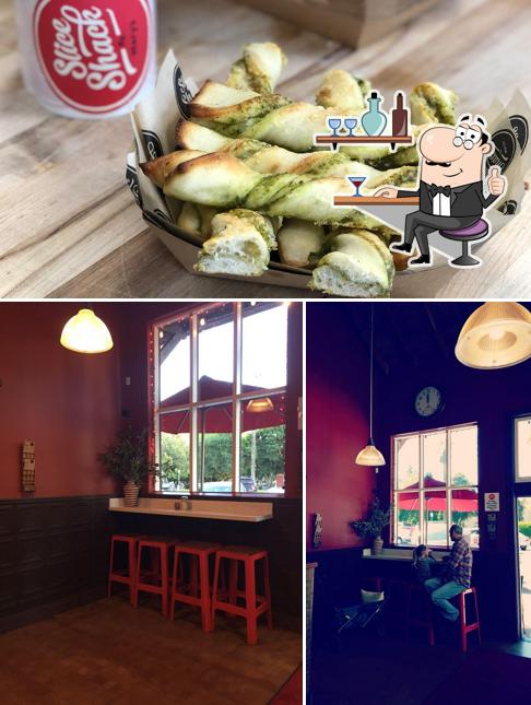 Check out the image showing interior and food at Slice Shack by Mary's