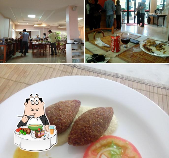 Esta é a imagem apresentando mesa de jantar e comida no Restaurante Bombocado