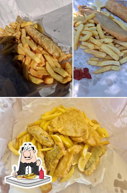 Taste French-fried potatoes at Andy's Fish & Chip Shop