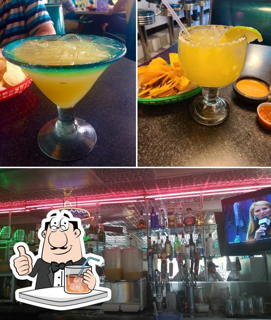The picture of drink and bar counter at Nachos & Beer