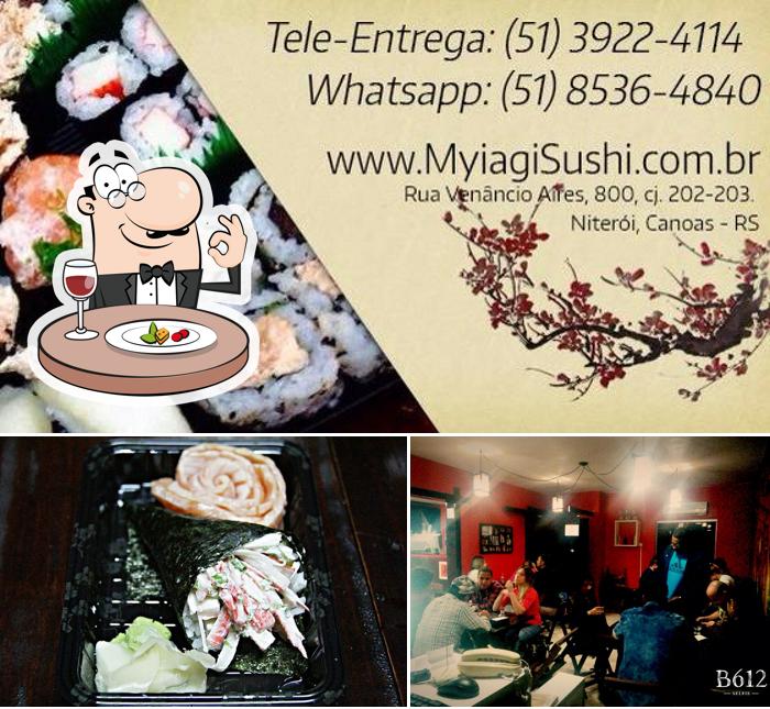 A imagem do Myiagi Sushi House’s comida e mesa de jantar