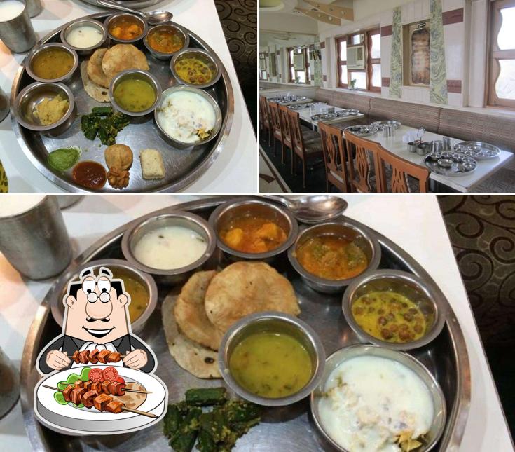 Laxmi Gujrati Thali is distinguished by food and dining table