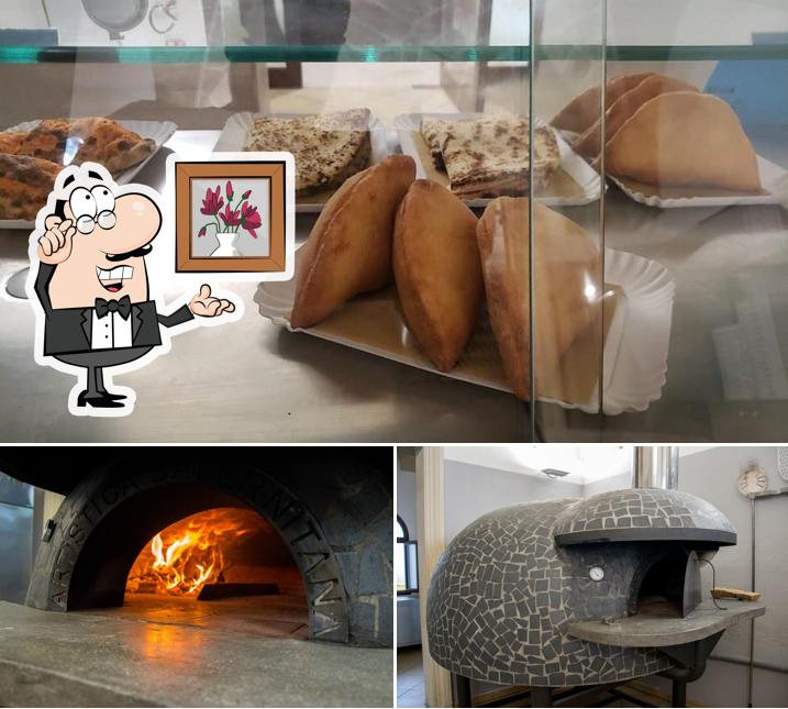 La immagine di interni e cibo da Pizzeria da Carlo