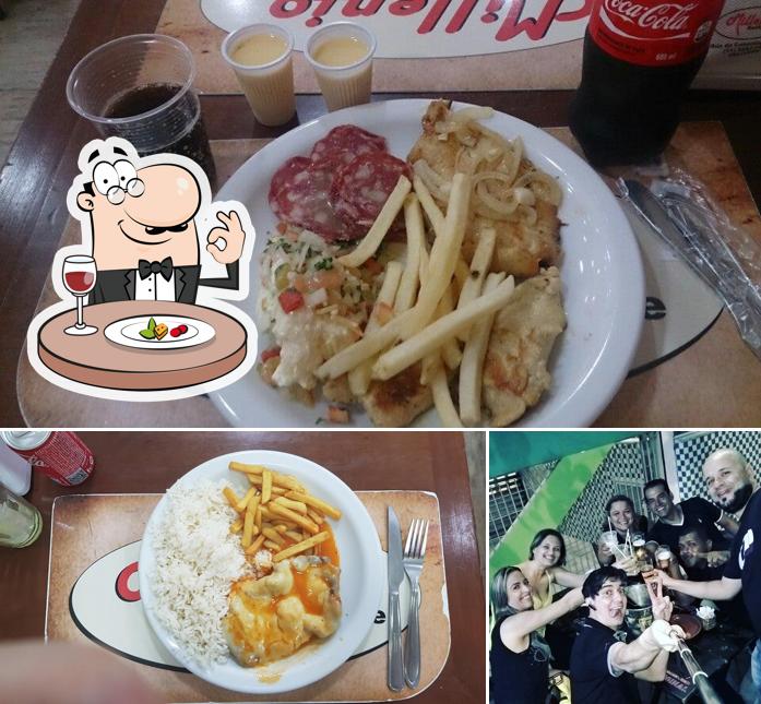 A foto do Millenio Restaurante’s comida e balcão de bar