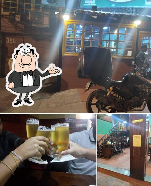 The image of interior and beer at Pizzaria Papito - loja Trindade