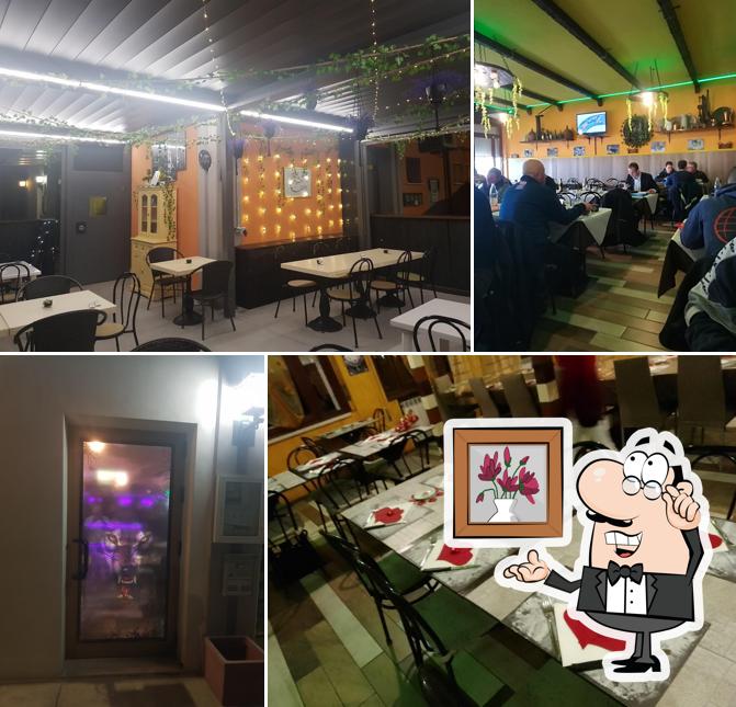 Siediti a un tavolo di Trattoria Pizzeria al Lupo