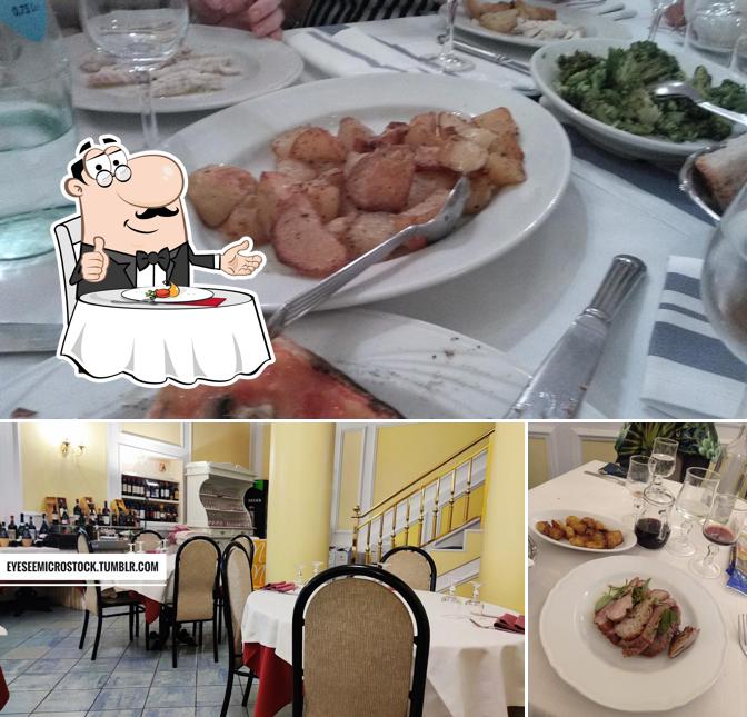 Parmi les différentes choses de la table à manger et la nourriture, une personne peut trouver sur Pizzeria trattoria Il Vicolo