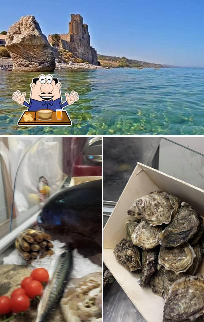 Guarda la foto che presenta la cibo e esterno di Ristorante Mediterraneo