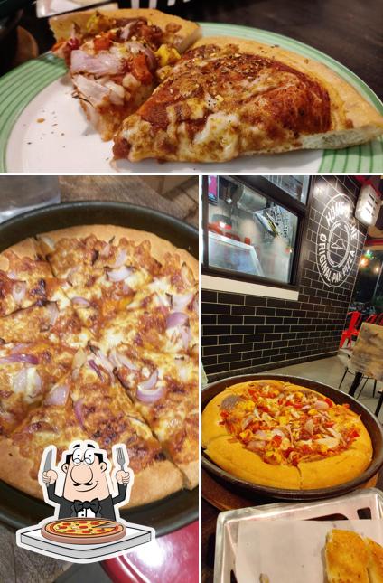 Try out pizza at Pizza Hut Vandemataram Road, Ahmedabad