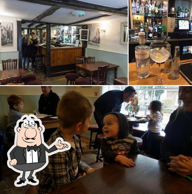 Check out the image showing interior and drink at The Cross Keys