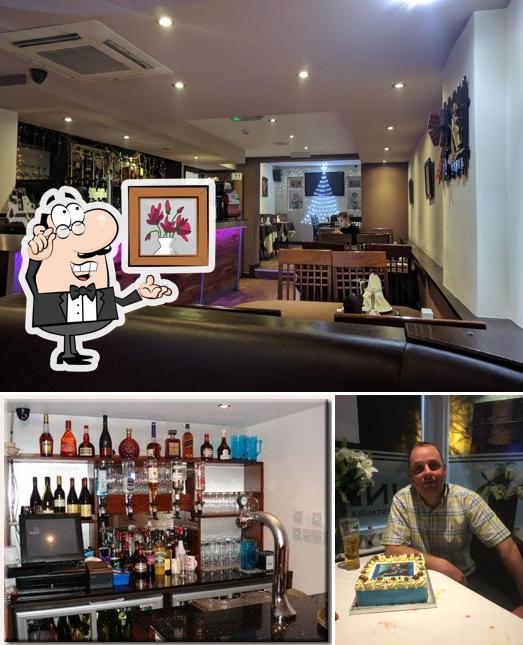 Check out the image displaying interior and food at Pizza Pitt lymm