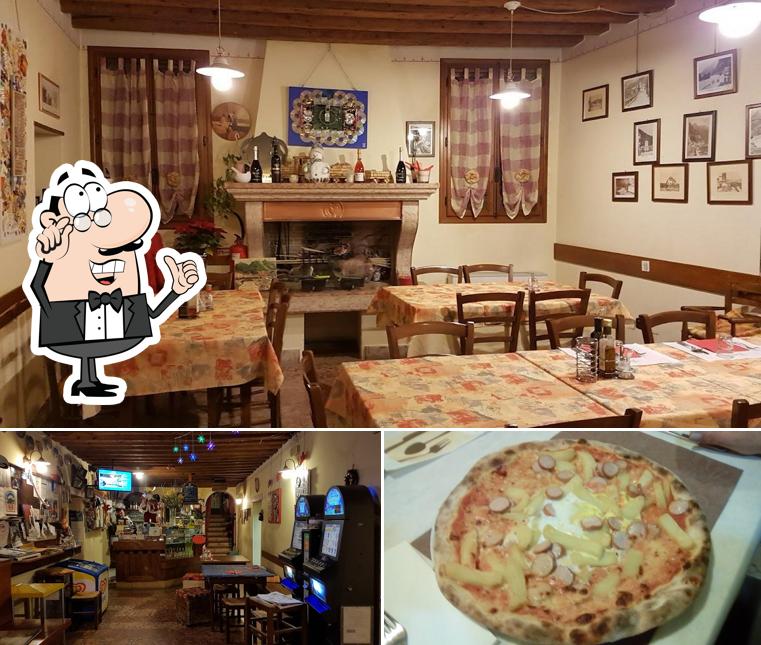 La foto della interni e pizza di Ristorante Pizzeria al Mondo