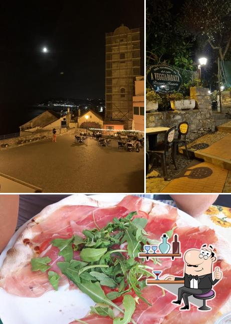 Guarda la foto che presenta la interni e cibo di Pizzeria A Veggia Baracca