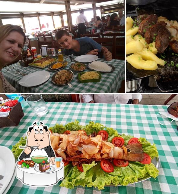 A foto da mesa de jantar e comida no Pizzaria Milão Sudoeste