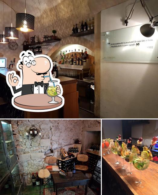 Guarda la foto che presenta la bevanda e interni di Giro Di Vite Osteria e Pizza