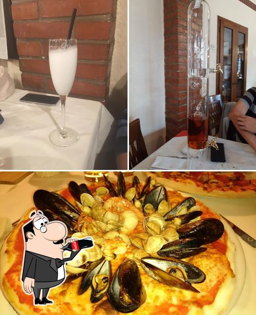 Estas son las imágenes donde puedes ver bebida y pizza en Monterosso Ristorante Pizzeria