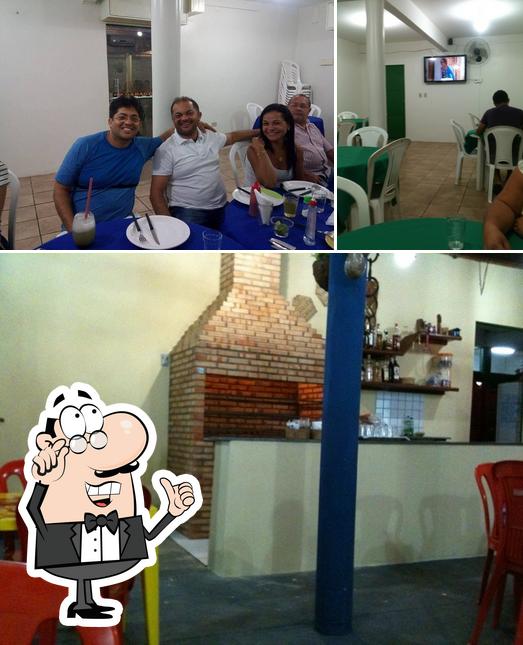 O interior do Garagem Pizzaria & Churrascaria