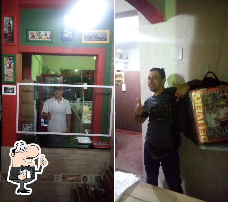 Look at the picture of Pizzaria entre amigos