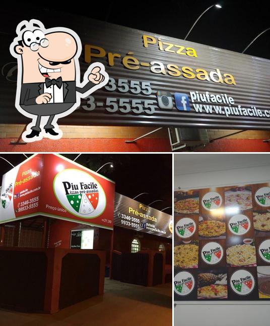 A exterior e pizza do restaurante