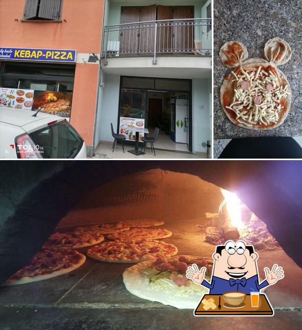 Dai un’occhiata alla immagine che mostra la cibo e interni di La Tana Della Pizza