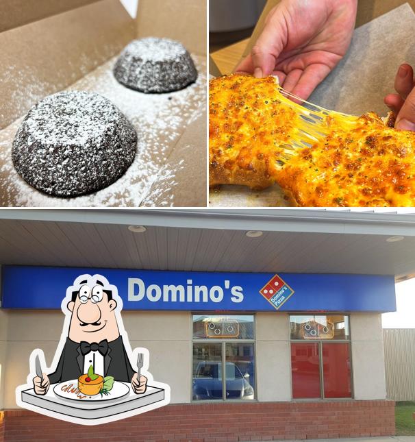 Фотография, на которой видны еда и внешнее оформление в Domino's Pizza