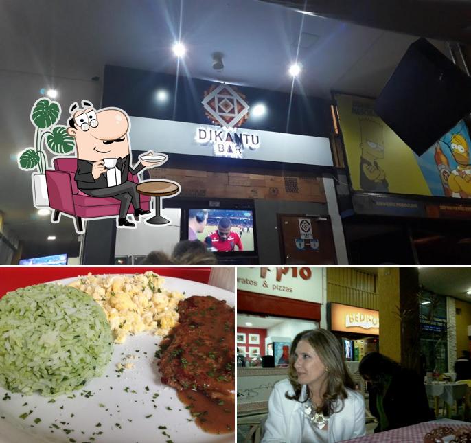 The photo of interior and food at Doppio Pratos e Pizzas