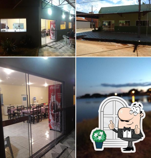 A imagem a Pizzaria Vitória’s exterior e interior