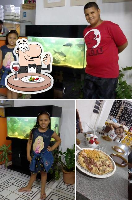 Comida em Pizzaria Aquarios