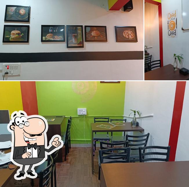 Check out the picture depicting interior and burger at Cloud Cafe