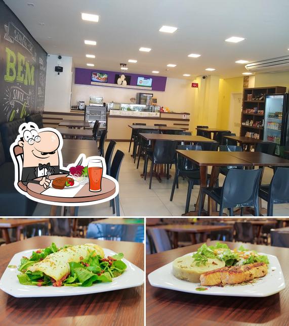 Esta é a foto mostrando mesa de jantar e interior no Mr. Fit Fast Food Saudável